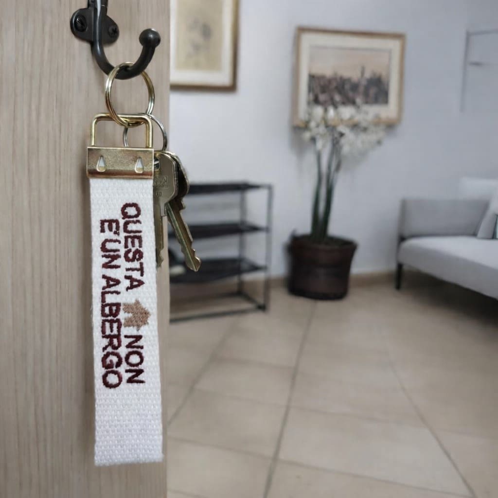 Portachiavi Stoffa "Questa casa non è un albergo"